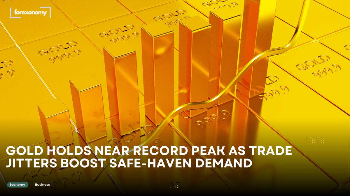 GOLD HOLDS NEAR RECORD PEAK AS TRADE JITTERS BOOST SAFE-HAVEN DEMAND